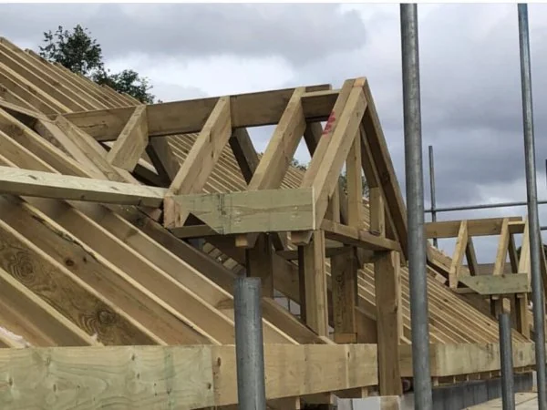 Roof rafters positioned over brickwork